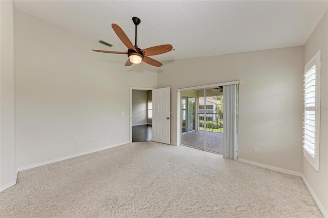 803 Montrose Dr Unit 201, Venice, FL 34293 - spare room with carpet flooring, ceiling fan, and lofted ceiling