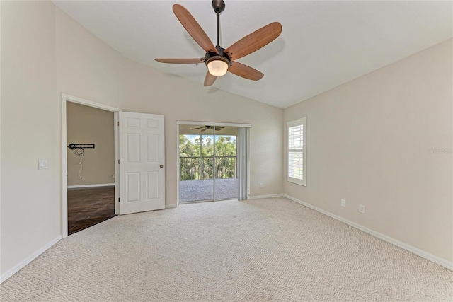 803 Montrose Dr Unit 201, Venice, FL 34293 - spare room featuring vaulted ceiling, carpet flooring, and a ceiling fan