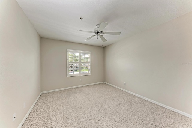 803 Montrose Dr Unit 201, Venice, FL 34293 - spare room featuring light carpet, ceiling fan, and a pendent fire sprinkler