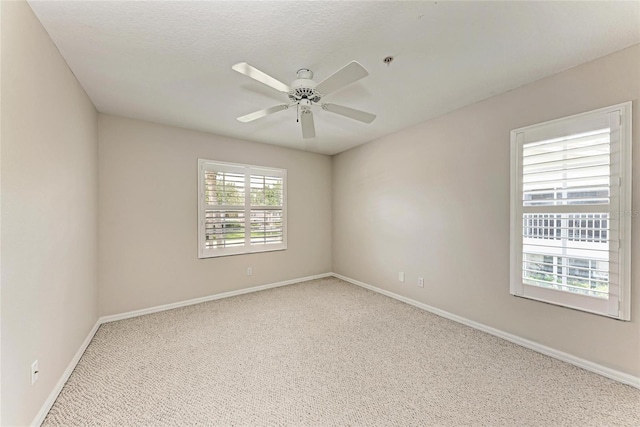 803 Montrose Dr Unit 201, Venice, FL 34293 - carpeted spare room featuring a ceiling fan and fire sprinkler in ceiling