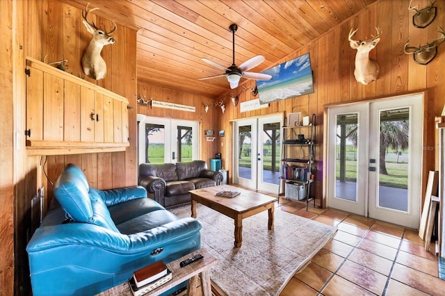 39700 State Road 70 E, Myakka City, FL 34251 - living area with french doors, wooden ceiling, wood walls, healthy amount of natural light, and tile patterned floors
