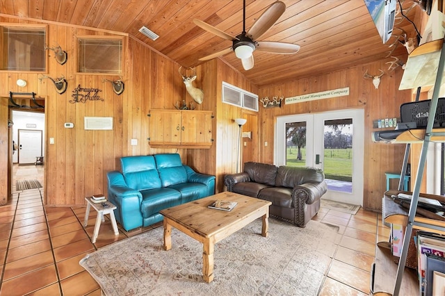 39700 State Road 70 E, Myakka City, FL 34251 - tiled living area with lofted ceiling, wood ceiling, wood walls, ceiling fan, and french doors