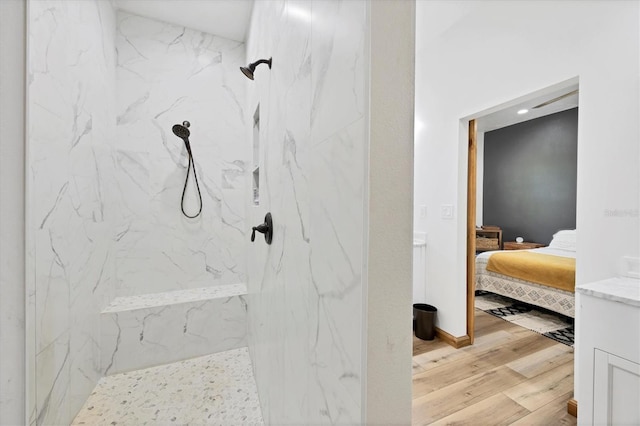 39700 State Road 70 E, Myakka City, FL 34251 - bathroom featuring wood finished floors, ensuite bathroom, and a marble finish shower