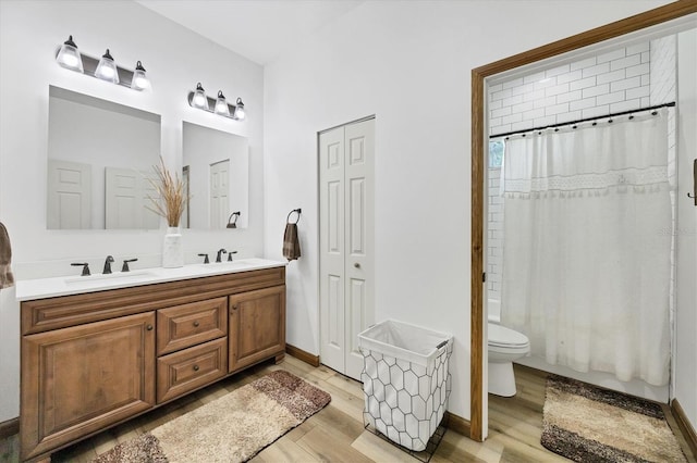 39700 State Road 70 E, Myakka City, FL 34251 - bathroom featuring wood finished floors, double vanity, and shower / bathtub combination with curtain