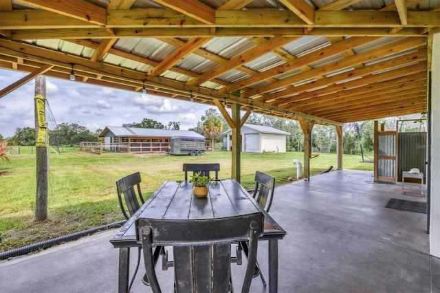 39700 State Road 70 E, Myakka City, FL 34251 - view of patio featuring an outbuilding and outdoor dining space
