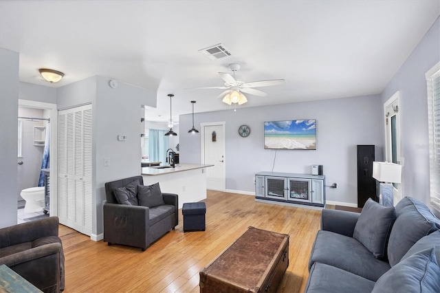 1778 N Salford Blvd, North Port, FL 34286 - living area featuring a ceiling fan and light wood-style flooring