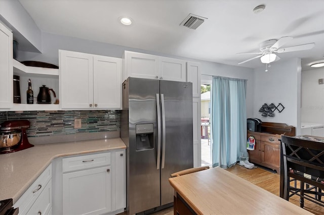 1778 N Salford Blvd, North Port, FL 34286 - kitchen featuring stainless steel fridge with ice dispenser, open shelves, white cabinetry, a ceiling fan, and backsplash