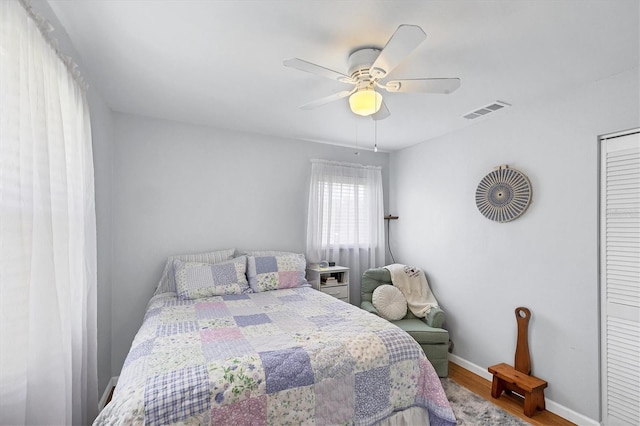 1778 N Salford Blvd, North Port, FL 34286 - bedroom with wood finished floors, ceiling fan, and a closet