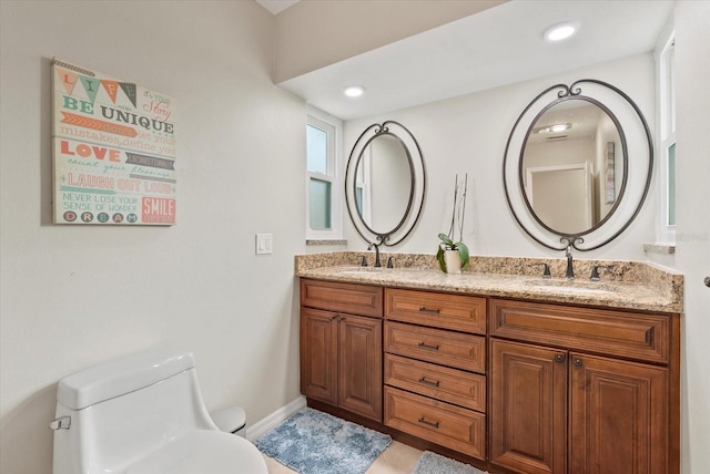 538 Magellan Dr, Sarasota, FL 34243 - bathroom with double vanity and recessed lighting