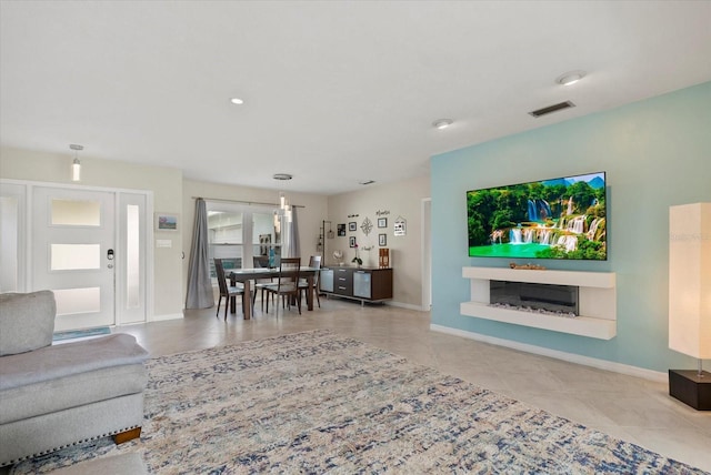 538 Magellan Dr, Sarasota, FL 34243 - living room with tile patterned flooring and recessed lighting