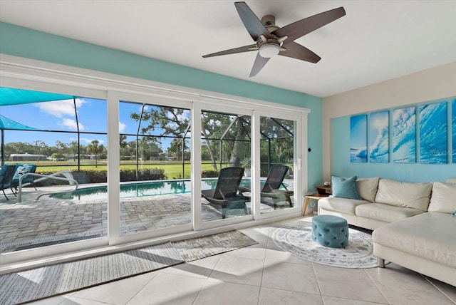 538 Magellan Dr, Sarasota, FL 34243 - tiled living area with a sunroom and a ceiling fan