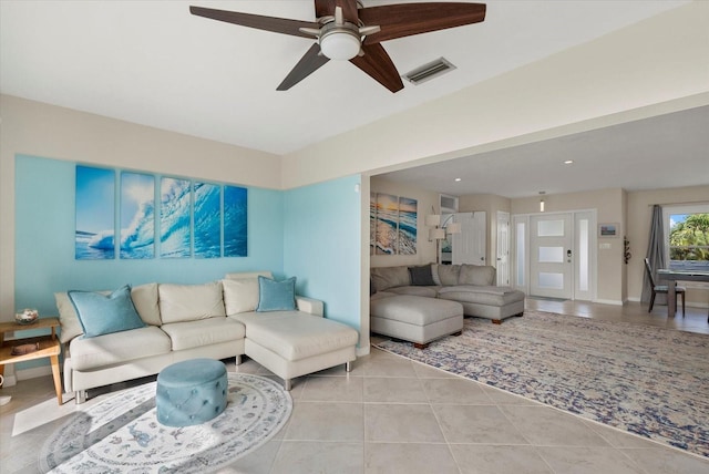 538 Magellan Dr, Sarasota, FL 34243 - living area with ceiling fan and light tile patterned floors