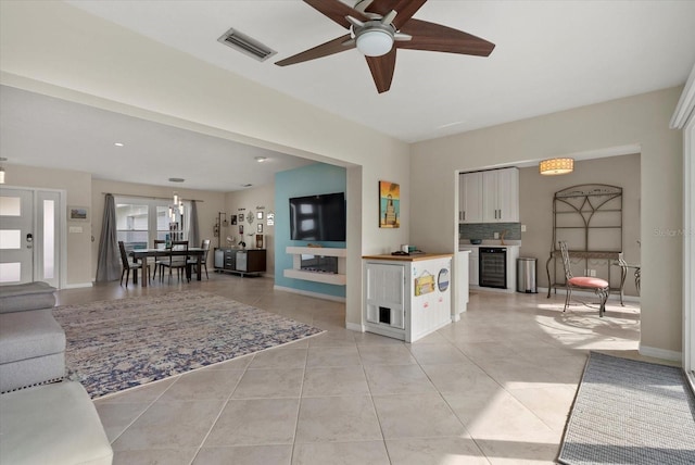 538 Magellan Dr, Sarasota, FL 34243 - living area with a ceiling fan and light tile patterned floors