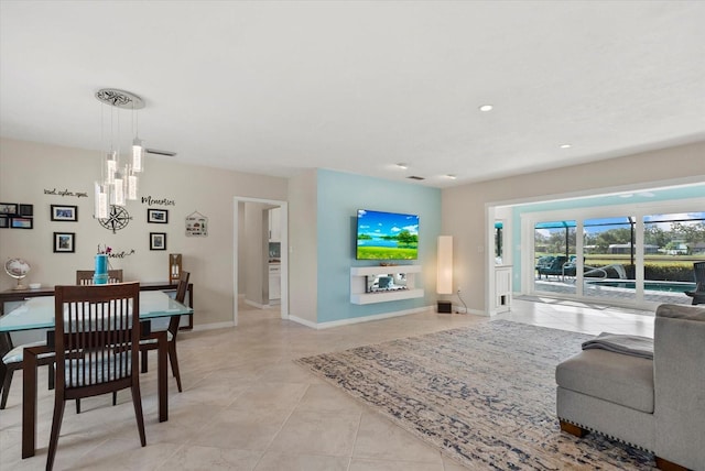 538 Magellan Dr, Sarasota, FL 34243 - living area with a chandelier, light tile patterned floors, and recessed lighting
