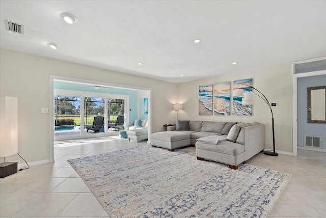 538 Magellan Dr, Sarasota, FL 34243 - living room featuring light tile patterned floors and recessed lighting