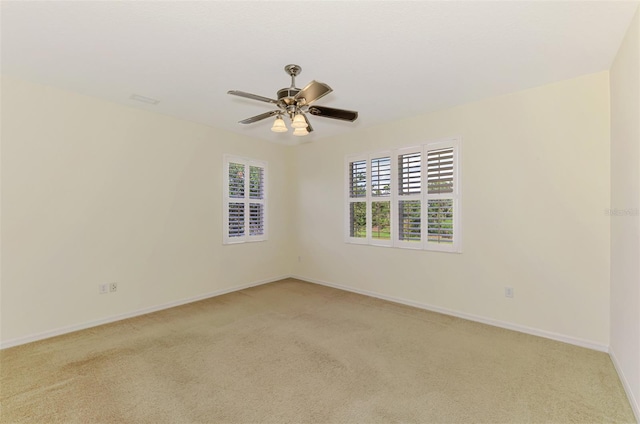 6610 Rosy Barb Ct, Lakewood Ranch, FL 34202 - empty room with light carpet and a ceiling fan
