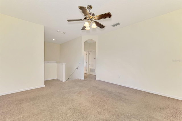 6610 Rosy Barb Ct, Lakewood Ranch, FL 34202 - empty room with arched walkways, light colored carpet, and ceiling fan