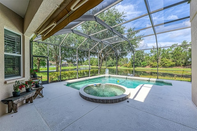 6610 Rosy Barb Ct, Lakewood Ranch, FL 34202 - view of pool featuring a water view, a patio area, view of wooded area, and a pool with connected hot tub