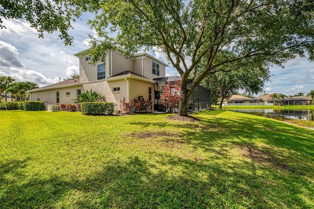 6610 Rosy Barb Ct, Lakewood Ranch, FL 34202 - view of grassy yard with a water view and a lanai