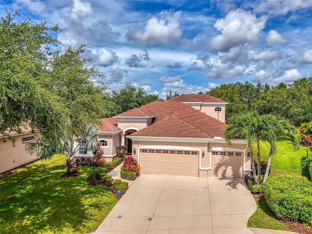 6610 Rosy Barb Ct, Lakewood Ranch, FL 34202 - mediterranean / spanish house featuring stucco siding, a garage, concrete driveway, and a front lawn