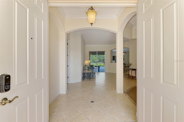 6610 Rosy Barb Ct, Lakewood Ranch, FL 34202 - corridor with arched walkways, crown molding, and light tile patterned flooring