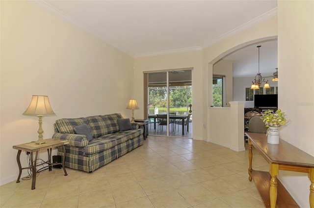 6610 Rosy Barb Ct, Lakewood Ranch, FL 34202 - living room with tile patterned floors, crown molding, and arched walkways