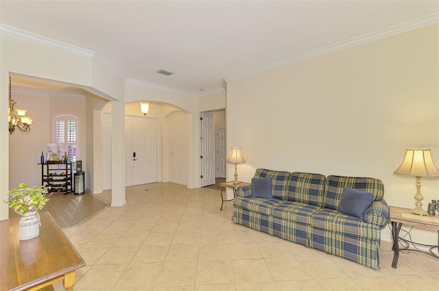 6610 Rosy Barb Ct, Lakewood Ranch, FL 34202 - living room with arched walkways, crown molding, light tile patterned floors, and a chandelier