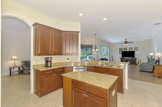 6610 Rosy Barb Ct, Lakewood Ranch, FL 34202 - kitchen featuring dishwasher, ceiling fan, a peninsula, light tile patterned floors, and a center island