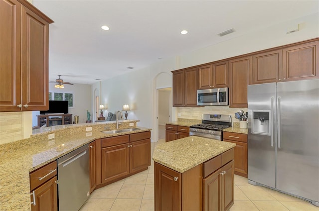 6610 Rosy Barb Ct, Lakewood Ranch, FL 34202 - kitchen featuring stainless steel appliances, light tile patterned floors, backsplash, and recessed lighting