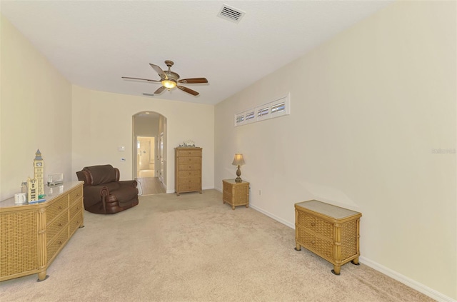 6610 Rosy Barb Ct, Lakewood Ranch, FL 34202 - sitting room featuring arched walkways, light carpet, and a ceiling fan