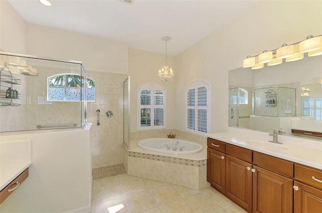 6610 Rosy Barb Ct, Lakewood Ranch, FL 34202 - full bathroom featuring tile patterned floors, vanity, a garden tub, tiled shower, and a chandelier