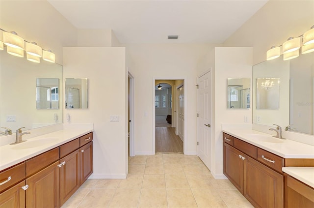 6610 Rosy Barb Ct, Lakewood Ranch, FL 34202 - bathroom with two vanities and tile patterned floors