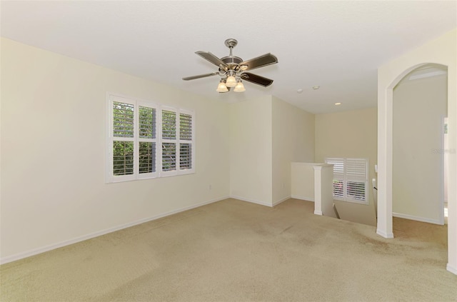 6610 Rosy Barb Ct, Lakewood Ranch, FL 34202 - empty room with light colored carpet, ceiling fan, and arched walkways