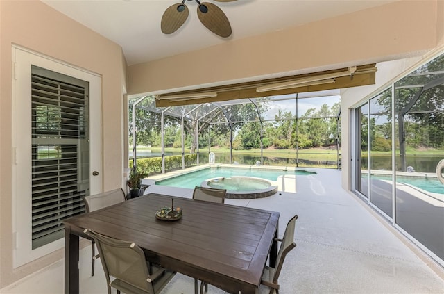 6610 Rosy Barb Ct, Lakewood Ranch, FL 34202 - swimming pool with a patio area, glass enclosure, a ceiling fan, and an in-ground hot tub