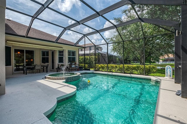6610 Rosy Barb Ct, Lakewood Ranch, FL 34202 - view of pool featuring a patio area, a pool with connected hot tub, and glass enclosure