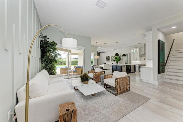12814 Daisy Pl, Bradenton, FL 34212 - living area with stairway, light wood-style flooring, and recessed lighting