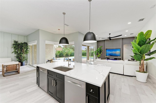 12814 Daisy Pl, Bradenton, FL 34212 - kitchen with dishwasher, light wood-style floors, ceiling fan, open floor plan, and recessed lighting