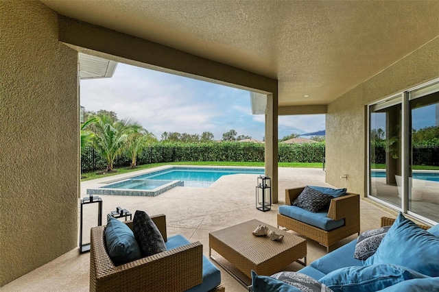 12814 Daisy Pl, Bradenton, FL 34212 - view of swimming pool with a patio area, an outdoor living space, a fenced backyard, and an in-ground hot tub