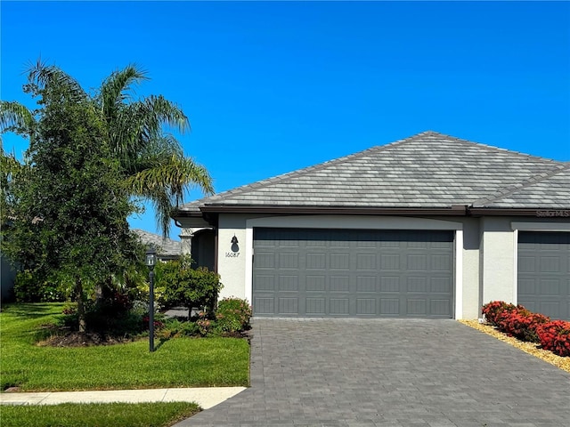 16087 Sunny Day Dr, Bradenton, FL 34211 - garage with decorative driveway