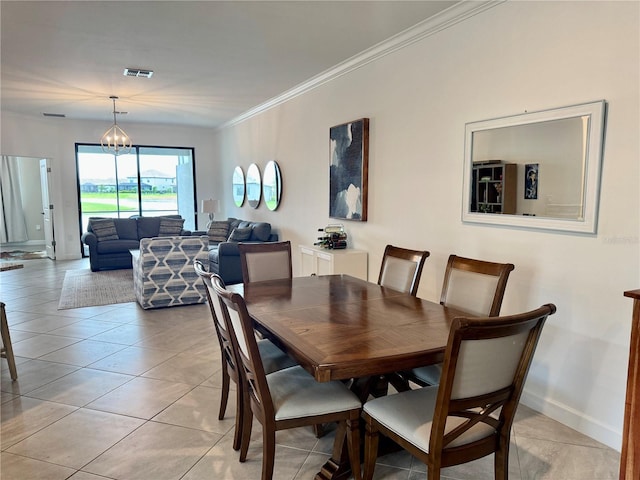 16087 Sunny Day Dr, Bradenton, FL 34211 - dining area featuring crown molding and light tile patterned flooring