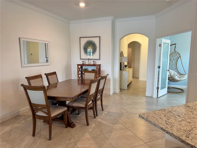 16087 Sunny Day Dr, Bradenton, FL 34211 - dining area featuring arched walkways, crown molding, and light tile patterned floors
