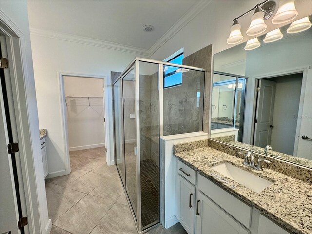 16087 Sunny Day Dr, Bradenton, FL 34211 - bathroom featuring vanity, a shower stall, a walk in closet, and ornamental molding