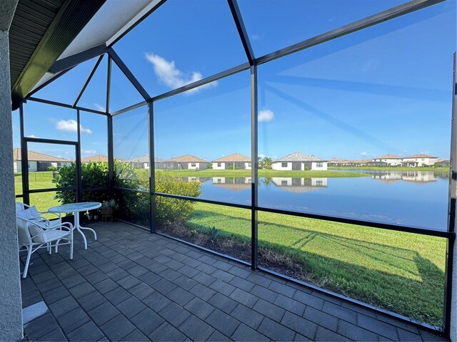 16087 Sunny Day Dr, Bradenton, FL 34211 - sunroom featuring a water view and a residential view