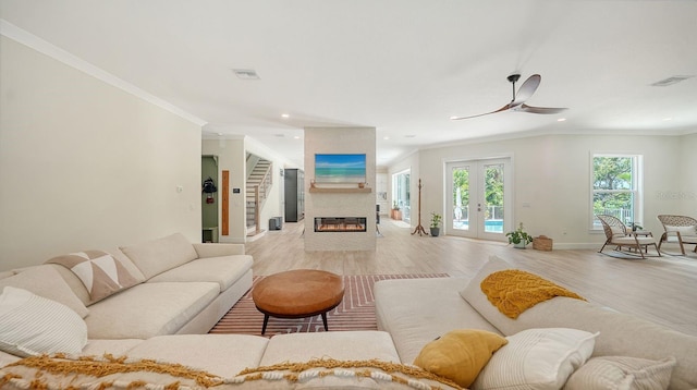 1076 Toc0Baga, Sarasota, FL 34234 - living room with ornamental molding, light wood-style floors, recessed lighting, ceiling fan, and a fireplace