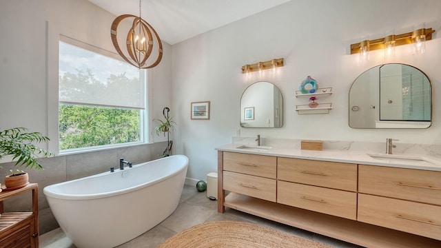 1076 Toc0Baga, Sarasota, FL 34234 - full bath with double vanity, a soaking tub, vaulted ceiling, and tile patterned floors