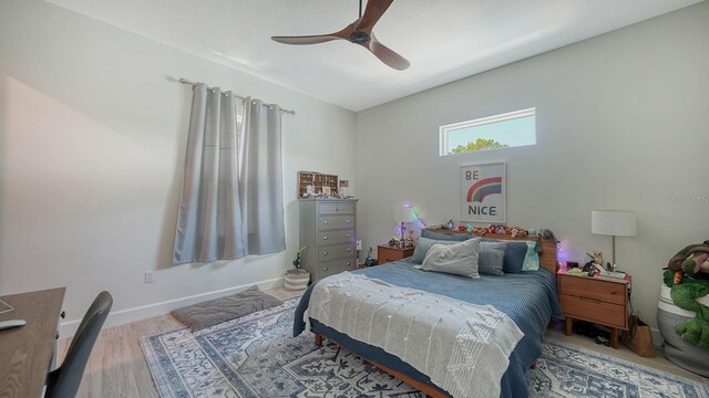 1076 Toc0Baga, Sarasota, FL 34234 - bedroom with wood finished floors and ceiling fan