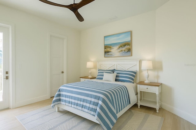 1076 Toc0Baga, Sarasota, FL 34234 - bedroom with wood finished floors and ceiling fan