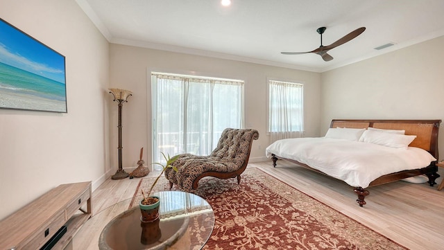 1076 Toc0Baga, Sarasota, FL 34234 - bedroom with wood finished floors, ornamental molding, and a ceiling fan