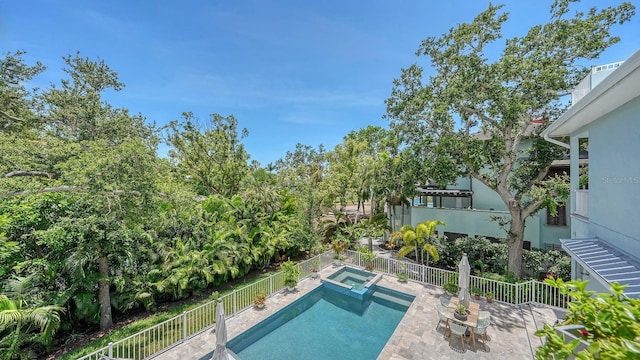 1076 Toc0Baga, Sarasota, FL 34234 - view of swimming pool with a fenced backyard, a patio area, and a pool with connected hot tub