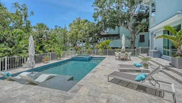 1076 Toc0Baga, Sarasota, FL 34234 - view of swimming pool with an in-ground hot tub and a patio area